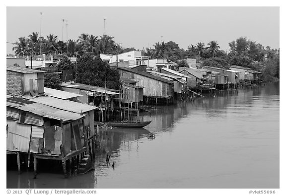 Riverside houses on stilts. Mekong Delta, Vietnam