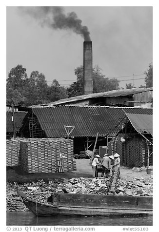 Workers moving bricks in brick factory. Sa Dec, Vietnam (black and white)