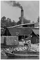Workers moving bricks in brick factory. Sa Dec, Vietnam (black and white)