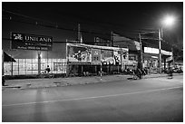 Street and stadium at night, District 8. Ho Chi Minh City, Vietnam ( black and white)