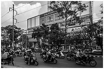 Motorcycle traffic and Hung Vuong Plaza mall. Cholon, Ho Chi Minh City, Vietnam ( black and white)