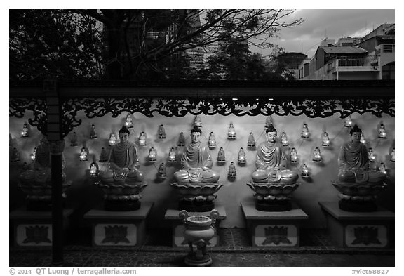 Buddha images at dusk, Viet Nam Quoc Tu pagoda. Ho Chi Minh City, Vietnam (black and white)