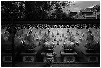 Buddha images at dusk, Viet Nam Quoc Tu pagoda. Ho Chi Minh City, Vietnam ( black and white)