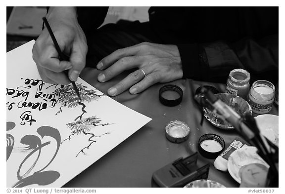 Hands drawing Tet greetings. Ho Chi Minh City, Vietnam (black and white)