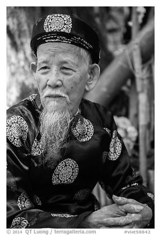 Elder in traditional costume. Ho Chi Minh City, Vietnam (black and white)