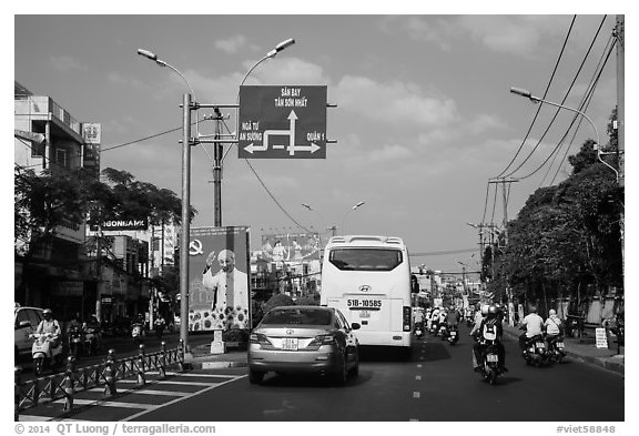 Boulevard and directional signs near airport. Ho Chi Minh City, Vietnam (black and white)