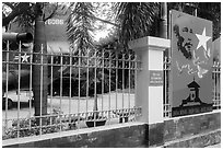US Helicopter tail and fence with poster, War Remnants Museum, district 3. Ho Chi Minh City, Vietnam ( black and white)