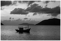Fishing boat and Con Son Bay, sunrise. Con Dao Islands, Vietnam ( black and white)