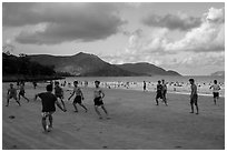 Men play soccer on beach, Con Son. Con Dao Islands, Vietnam ( black and white)
