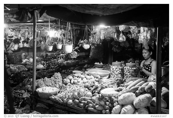 Vegetable seller at night, Con Dao Market, Con Son. Con Dao Islands, Vietnam (black and white)