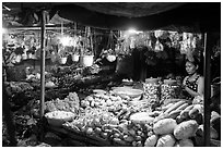 Vegetable seller at night, Con Dao Market, Con Son. Con Dao Islands, Vietnam ( black and white)