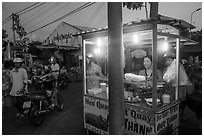 Food vendor at dusk, Con Dao Market, Con Son. Con Dao Islands, Vietnam ( black and white)