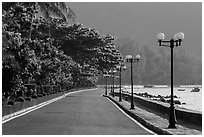 Deserted seafront promenade lined up with lamps, Con Son. Con Dao Islands, Vietnam ( black and white)