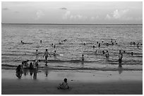 Beachgoers at sunset, Con Son. Con Dao Islands, Vietnam ( black and white)