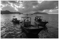 Fishing boats at sunrise, Con Son harbor. Con Dao Islands, Vietnam ( black and white)