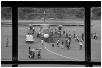 Airport tarmac with just deplaned passengers. Con Dao Islands, Vietnam ( black and white)