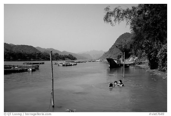 River with kids playing, Son Trach. Vietnam (black and white)