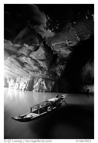 Boat inside the lower cave, Phong Nha Cave. Vietnam (black and white)