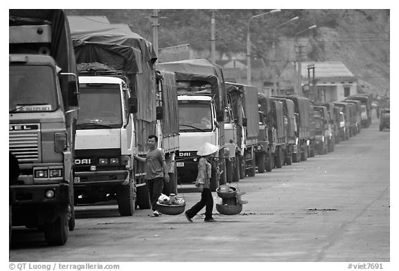 Trucks waiting to cross the border into China at Dong Dang. Lang Son, Northest Vietnam (black and white)