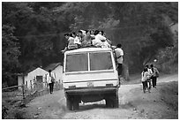 Passengers sitting on top of an overloaded bus. Northest Vietnam ( black and white)