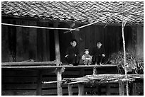 Women and child of the Nung ethnicity in front of their home. Northeast Vietnam ( black and white)
