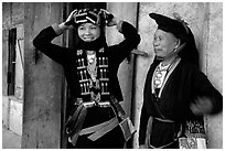Two generations of tribewomen outside their house, near Mai Chau. Northwest Vietnam ( black and white)