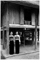 Two thai women standing in front of their stilt house, Ban Lac village. Northwest Vietnam ( black and white)