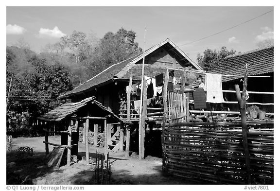 Woman drying laundry in a montagnard village near Son La. Northwest Vietnam (black and white)