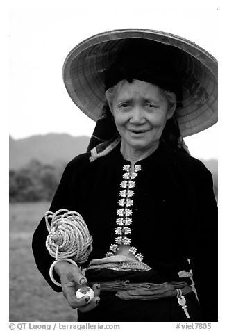 Thai woman wearing her traditional dress under the Vietnamese conical hat, near Son La. Northwest Vietnam (black and white)
