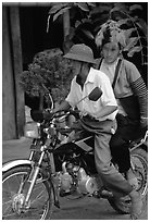 Dzao woman riding at the back of a motorbike, Tuan Giao. Northwest Vietnam (black and white)