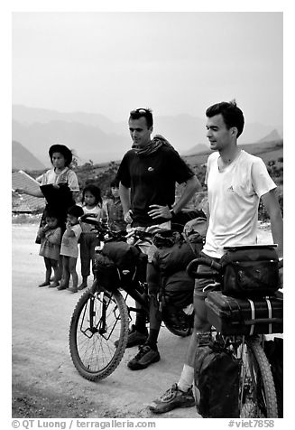 Western adventure travellers on mountain bikes, near Tam Duong. Northwest Vietnam (black and white)