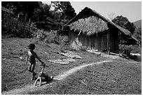 Unclothed child in a minority village, between Lai Chau and Tam Duong. Northwest Vietnam (black and white)