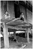 Two children in a stilt house, between Lai Chau and Tam Duong. Northwest Vietnam (black and white)