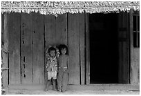 Two kids in front of a hut. Hong Chong Peninsula, Vietnam (black and white)