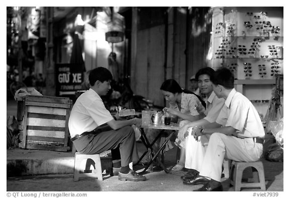 Enjoying a cafe on the streets, sitting on the typical tiny chairs. Ho Chi Minh City, Vietnam