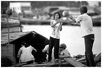 Unloading watermelons from a boat. Ha Tien, Vietnam ( black and white)