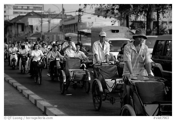 Cyclos and morning traffic. Ho Chi Minh City, Vietnam