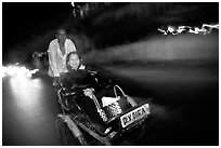 Enjoying the freshness of the night during a cyclo ride. Ho Chi Minh City, Vietnam (black and white)