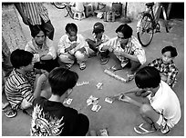 Children playing cards. Ho Chi Minh City, Vietnam (black and white)
