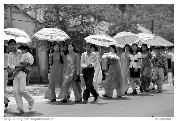 Traditional wedding procession on a countryside road. Ben Tre, Vietnam
