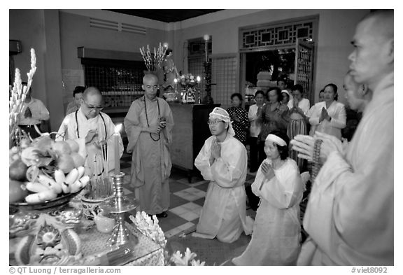 Buddhist funeral ceremony. White is color for mourning, Xa Loi pagoda, district 3. Ho Chi Minh City, Vietnam (black and white)