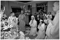 Buddhist funeral ceremony. White is color for mourning, Xa Loi pagoda, district 3. Ho Chi Minh City, Vietnam ( black and white)