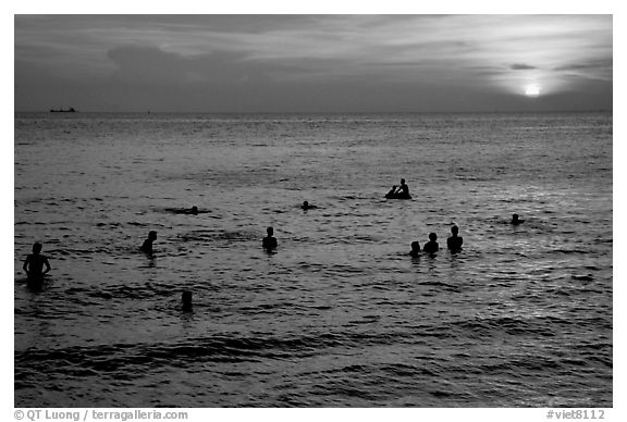 Soaking in the warm China sea at sunset. Vung Tau, Vietnam (black and white)