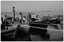 Children play on fishing boats. Vung Tau, Vietnam ( black and white)