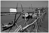 An ice block being loaded into a fishing boat. Vung Tau, Vietnam (black and white)