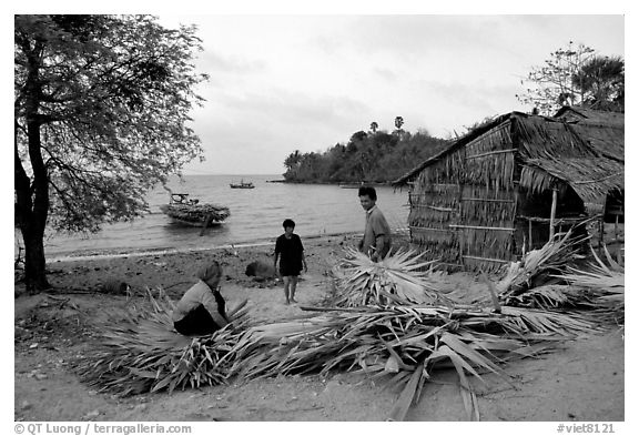 Fishing village with huts made of banana leaves. Hong Chong Peninsula, Vietnam (black and white)