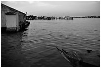 Floating houses. They double as fish reservoirs. Chau Doc, Vietnam ( black and white)