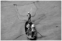 Fisherman casting net seen from above. Can Tho, Vietnam (black and white)