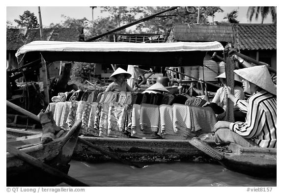Garnments for sale on the Phong Dien floating market. Can Tho, Vietnam (black and white)
