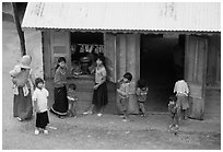 Gathering at the village store, in a minority village. Da Lat, Vietnam ( black and white)